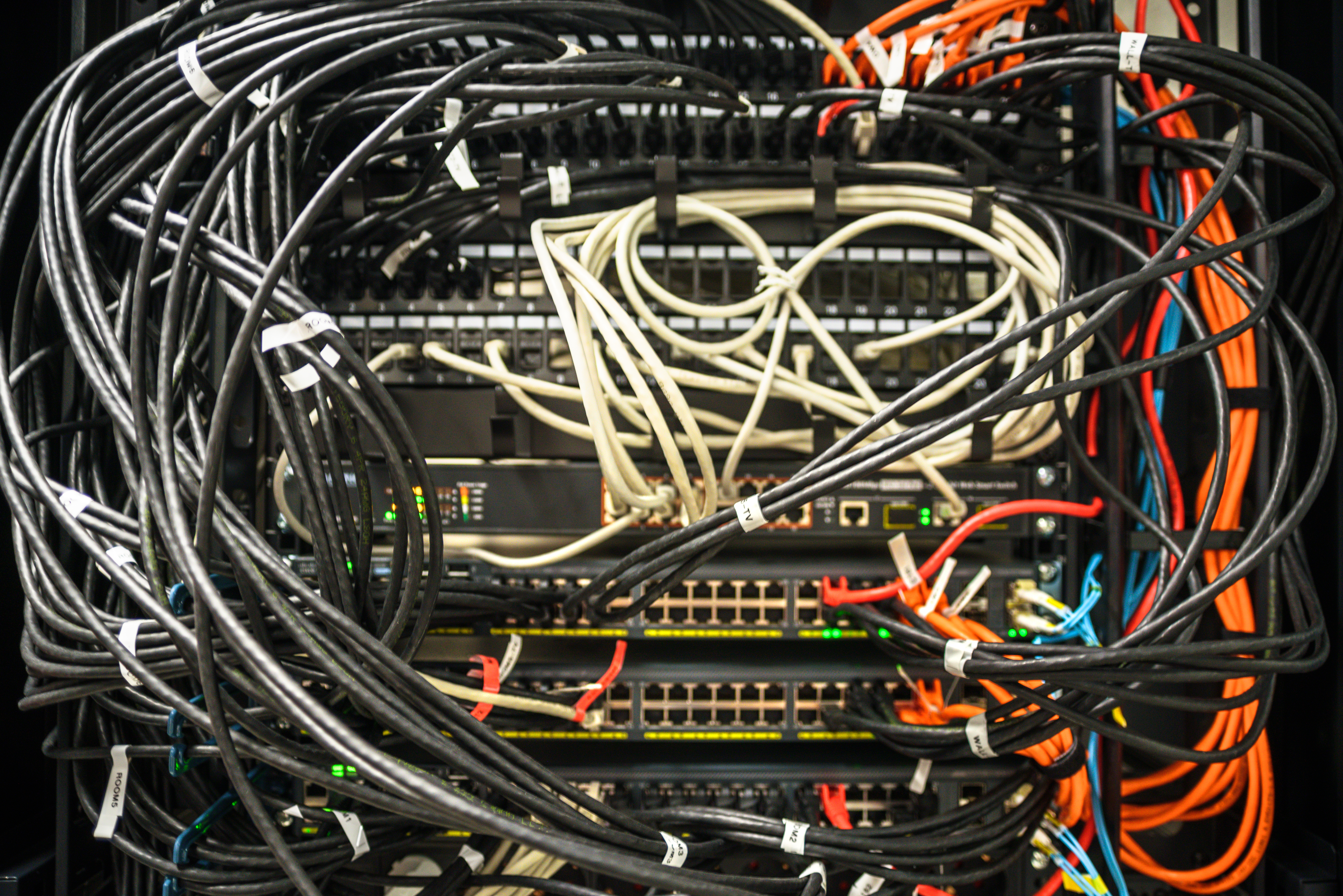Working network hardware in a mess. Labels with port numbers on wires